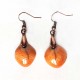 Boucles d'oreilles oranges gaies et lumineuses